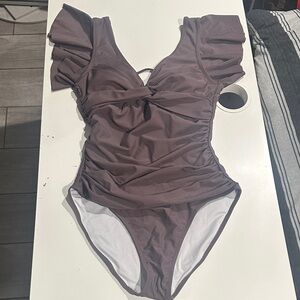 Ruffled One-Piece Swimsuit in Mauve.